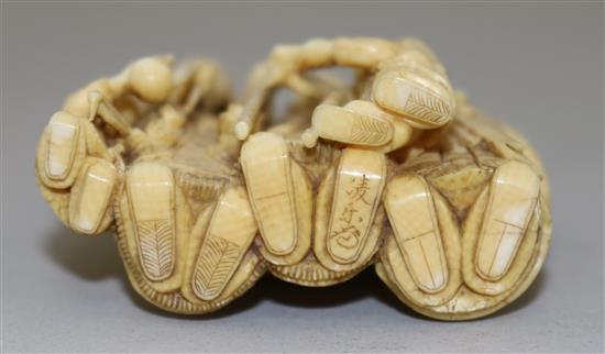 A Japanese ivory okimono of three sages and two attendant children, Meiji period, height 5.9cm